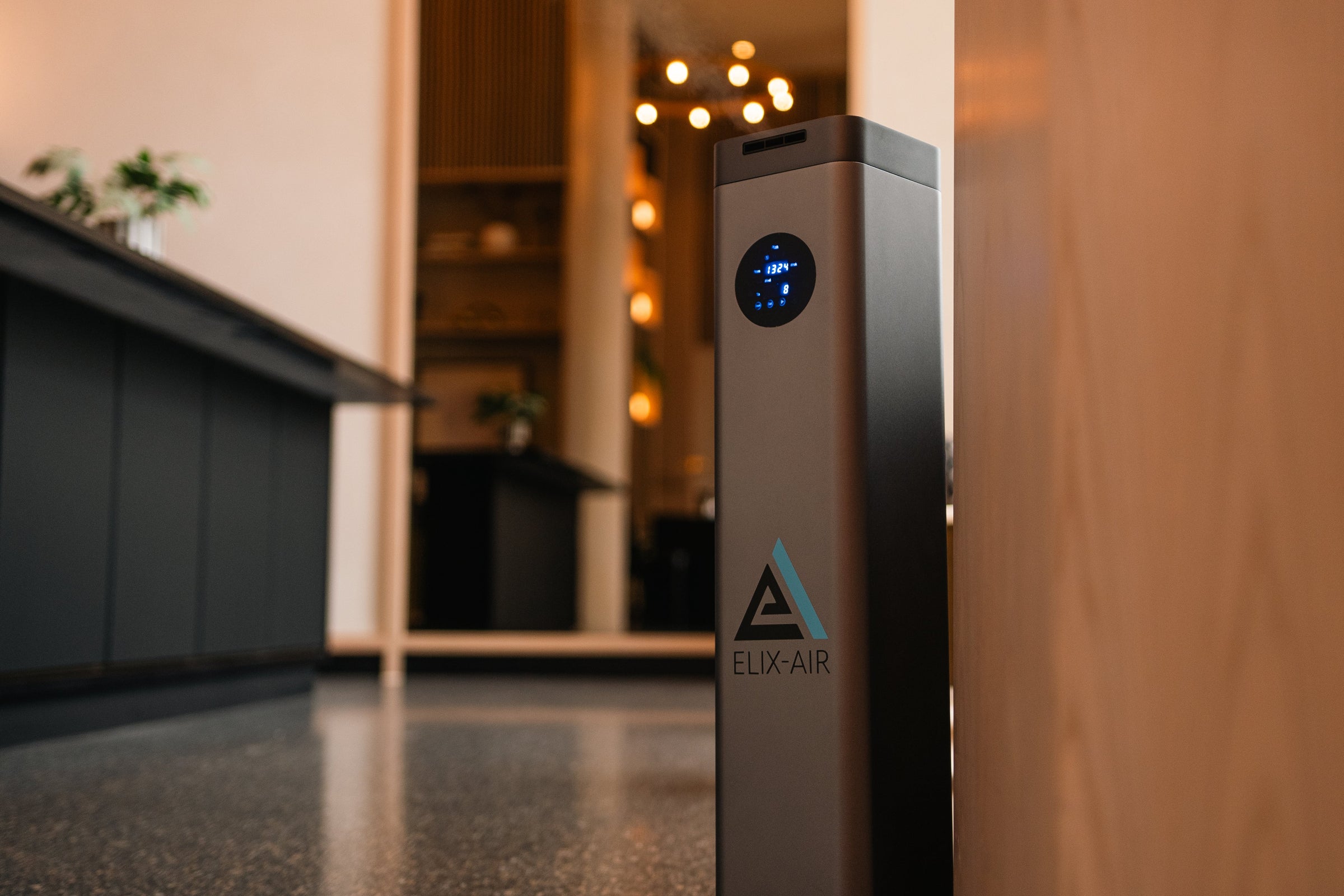 Softly lit apartment block foyer with a scent machine scent diffuser