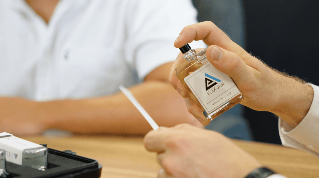 Perfume Scent Sample bottle being sprayed onto a scent spill
